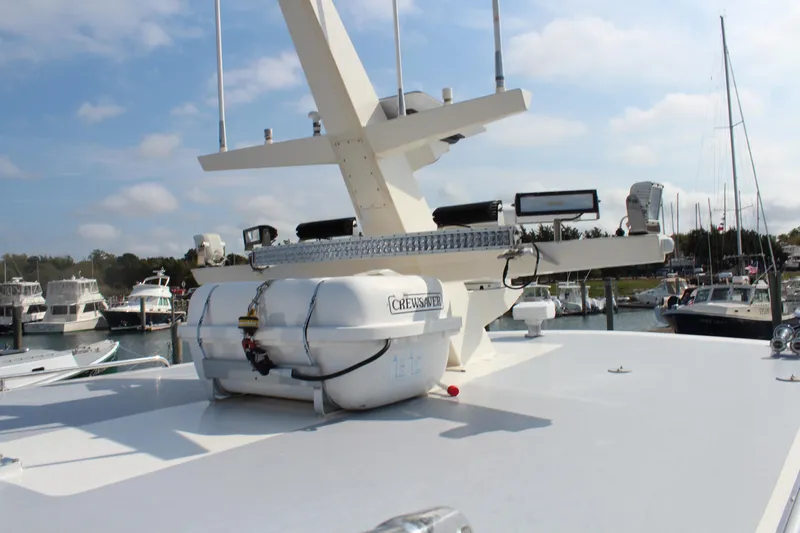 Miss Jennie Yacht Photos Pics 2008 H&H Marine 38 boat deck with equipment, docked in a marina.