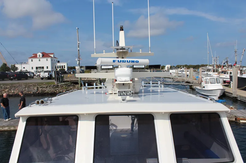 Miss Jennie Yacht Photos Pics 2008 H&H Marine 38 boat docked at a marina with clear blue skies.