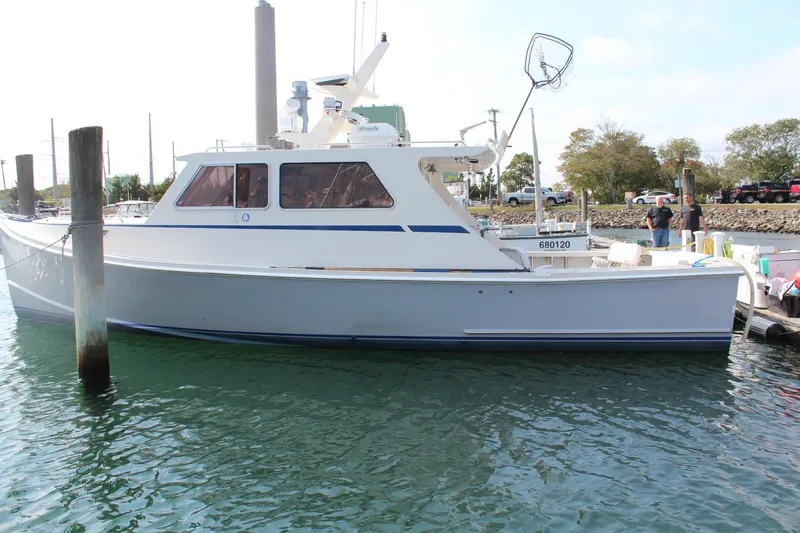 Miss Jennie Yacht Photos Pics 2008 H&H Marine 38 boat docked in a marina, side view.