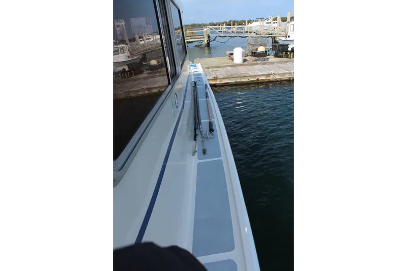 Miss Jennie Yacht Photos Pics 2008 H&H Marine 38 boat docked at a marina, side view.