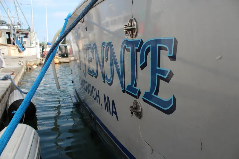 Miss Jennie Yacht Photos Pics 2008 H&H Marine 38 boat docked, featuring bold lettering and blue rope.