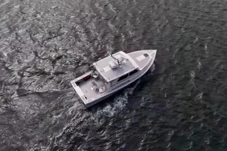 Miss Jennie Yacht Photos Pics 2008 H&H Marine 38 boat cruising on open water, aerial view.