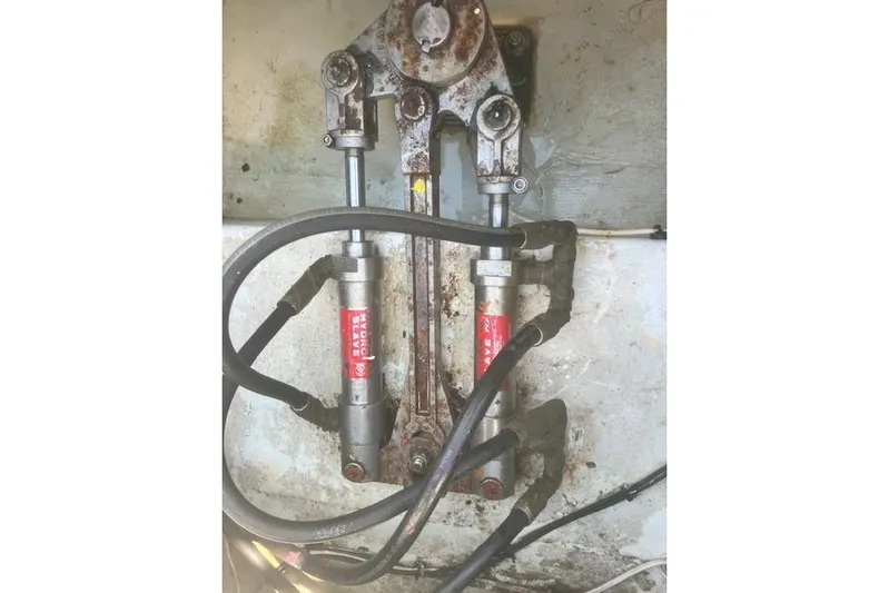 Miss Jennie Yacht Photos Pics Hydraulic steering system of a 2008 H&H Marine 38 boat, showing hoses and cylinders.