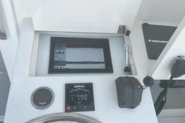 Miss Jennie Yacht Photos Pics Control panel of a 2008 H&H Marine 38 boat with navigation instruments.