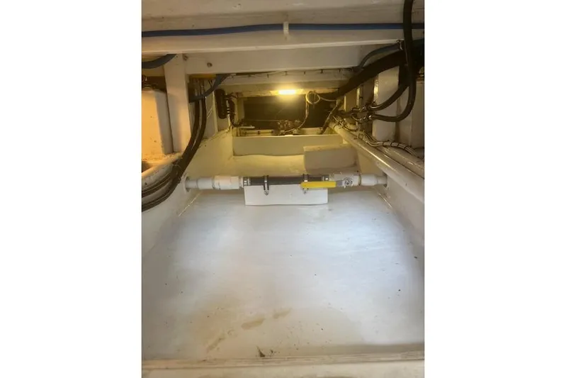 Miss Jennie Yacht Photos Pics Engine compartment of a 2008 H&H Marine 38 boat, featuring visible wiring and components.