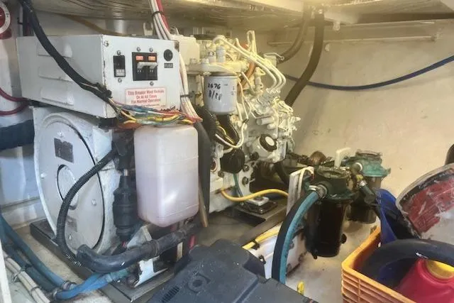 Miss Jennie Yacht Photos Pics Engine room of 2008 H&H Marine 38 boat with mechanical components and wiring.