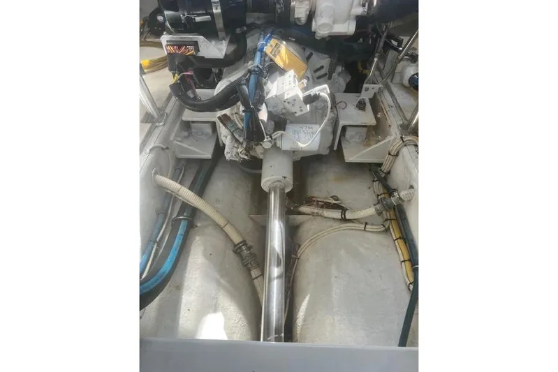 Miss Jennie Yacht Photos Pics Engine compartment of a 2008 H&H Marine 38 boat, showing mechanical components and wiring.