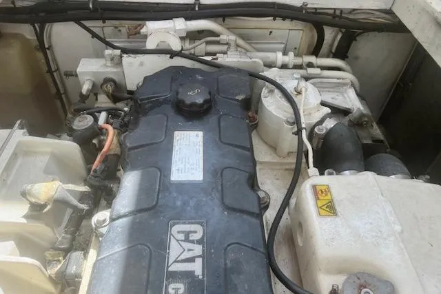 Miss Jennie Yacht Photos Pics Engine compartment of a 2008 H&H Marine 38 boat with CAT engine components.