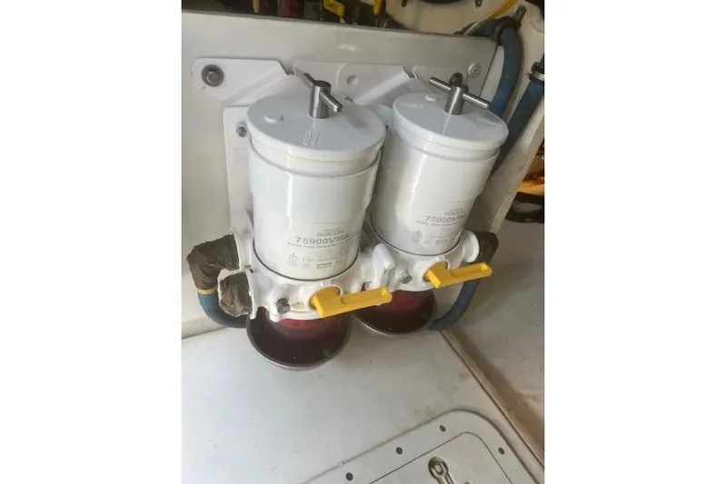 Miss Jennie Yacht Photos Pics Dual fuel filters in a 2008 H&H Marine 38 boat engine compartment.