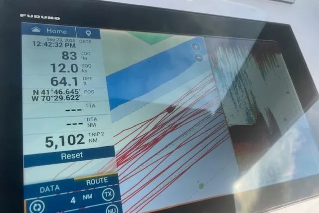 Miss Jennie Yacht Photos Pics Boat navigation display showing coordinates and depth on H&H Marine 38, 2008 model.