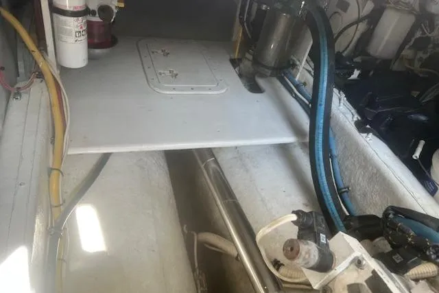 Miss Jennie Yacht Photos Pics Engine compartment of a 2008 H&H Marine 38 boat, showing mechanical components and wiring.