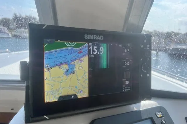 Miss Jennie Yacht Photos Pics Simrad navigation display on 2008 H&H Marine 38 boat, showing map and data.