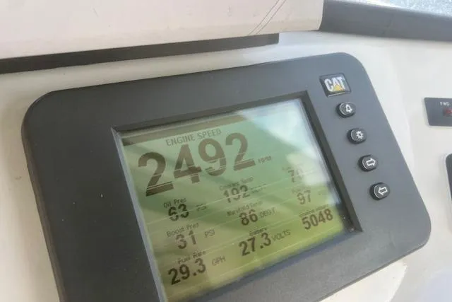 Miss Jennie Yacht Photos Pics Digital display showing engine speed and metrics on a 2008 H&H Marine 38 boat.