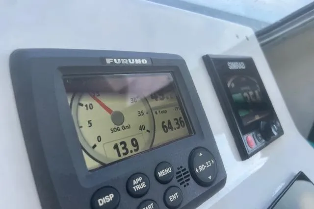 Miss Jennie Yacht Photos Pics Electronic navigation instruments on a 2008 H&H Marine 38 boat dashboard.