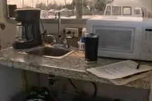 Miss Jennie Yacht Photos Pics Galley area in 2008 H&H Marine 38 with coffee maker, microwave, and sink.