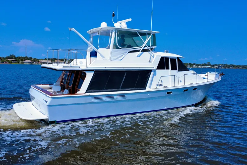 Perseverance Yacht Photos Pics 1989 Bayliner 4588 Motoryacht cruising on a sunny day, showcasing sleek design and elegance.