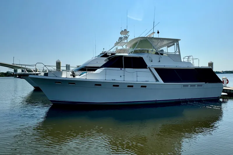 Perseverance Yacht Photos Pics 1989 Bayliner 4588 Motoryacht docked on calm water under clear sky.
