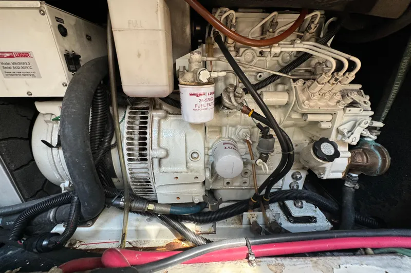 Perseverance Yacht Photos Pics Engine compartment of a 1989 Bayliner 4588 Motoryacht, showcasing detailed mechanical components.