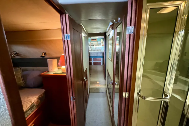 Perseverance Yacht Photos Pics Interior of 1989 Bayliner 4588 Motoryacht, featuring cozy cabins and elegant wood finishes.