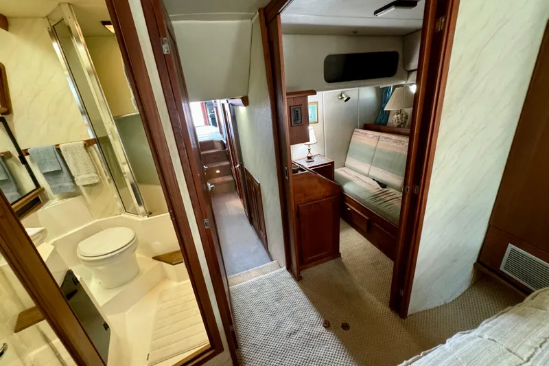 Perseverance Yacht Photos Pics Interior of a 1989 Bayliner 4588 Motoryacht featuring a bathroom and cozy seating area.