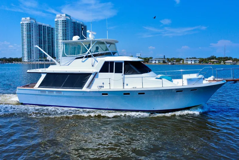 Perseverance Yacht Photos Pics 1989 Bayliner 4588 Motoryacht cruising on water with cityscape background.