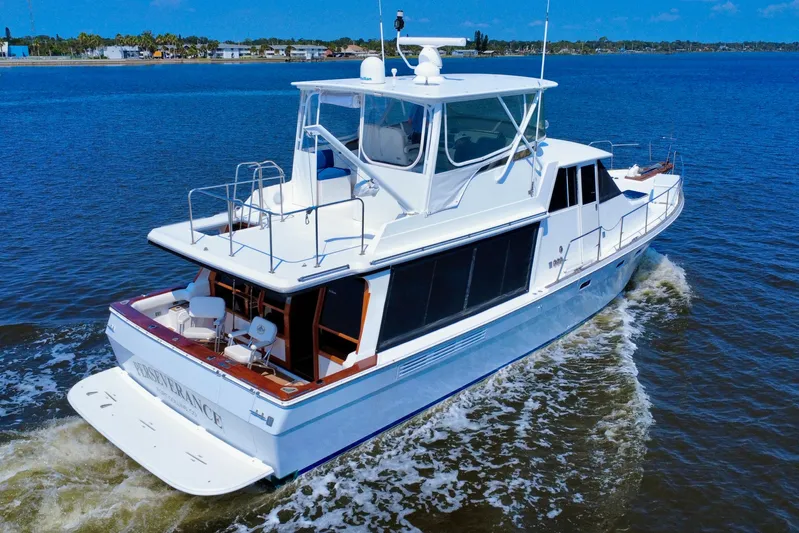 Perseverance Yacht Photos Pics 1989 Bayliner 4588 Motoryacht cruising on open water under clear blue skies.