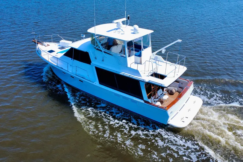 Perseverance Yacht Photos Pics 1989 Bayliner 4588 Motoryacht cruising on open water, aerial view.