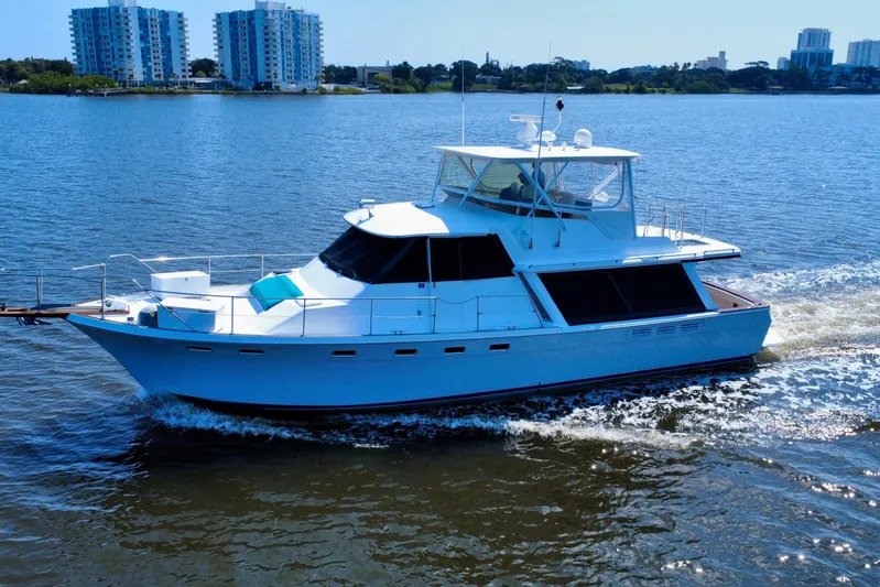 Perseverance Yacht Photos Pics 1989 Bayliner 4588 Motoryacht cruising on a sunny day near urban skyline.