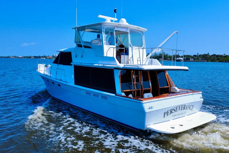 Perseverance Yacht Photos Pics 1989 Bayliner 4588 Motoryacht cruising on a sunny day, named "Perseverance."