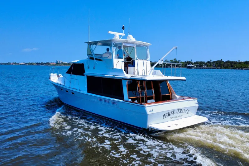 Perseverance Yacht Photos Pics 1989 Bayliner 4588 Motoryacht cruising on a sunny day, named "Perseverance."