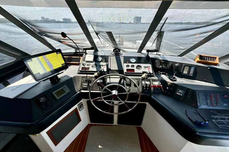 Perseverance Yacht Photos Pics 1989 Bayliner 4588 Motoryacht helm with navigation equipment and steering wheel.