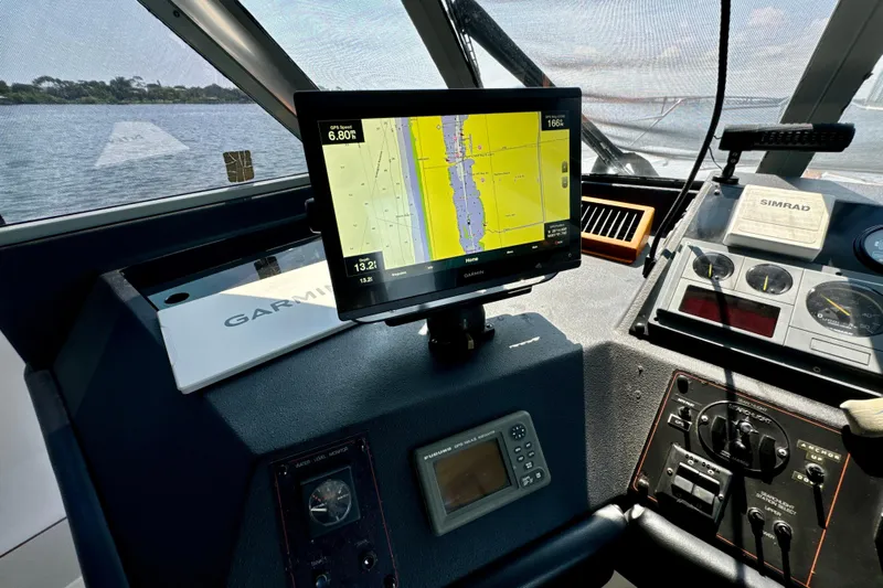 Perseverance Yacht Photos Pics Cockpit of 1989 Bayliner 4588 Motoryacht with navigation equipment and GPS display.