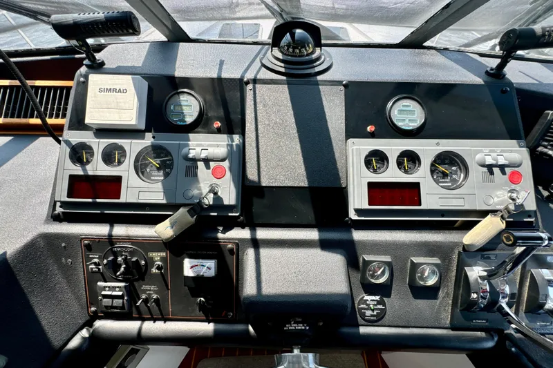 Perseverance Yacht Photos Pics Control panel of a 1989 Bayliner 4588 Motoryacht with gauges and navigation equipment.