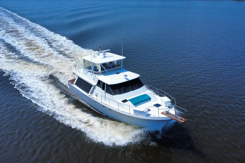 Perseverance Yacht Photos Pics 1989 Bayliner 4588 Motoryacht cruising on open water, leaving a wake behind.