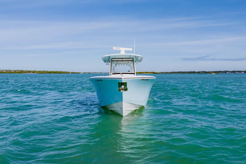  Yacht Photos Pics 2017 Cobia 344 Center Console boat on clear blue water under a sunny sky.