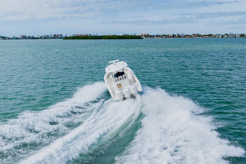  Yacht Photos Pics 2017 Cobia 344 Center Console boat cruising on open water.