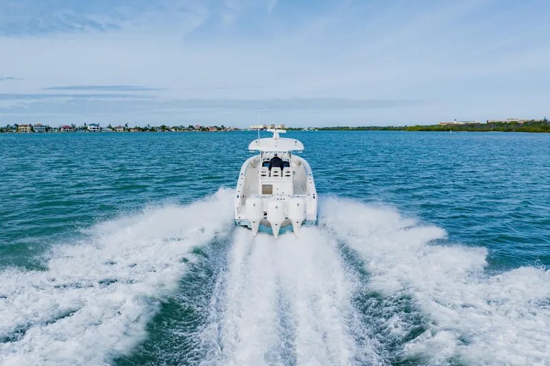  Yacht Photos Pics 2017 Cobia 344 Center Console boat cruising on open water.