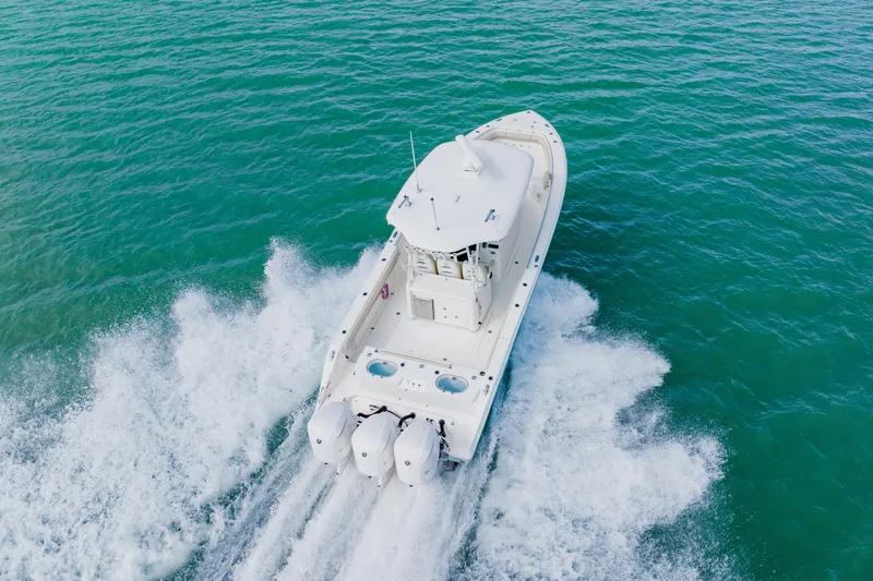  Yacht Photos Pics 2017 Cobia 344 Center Console boat cruising on open water.