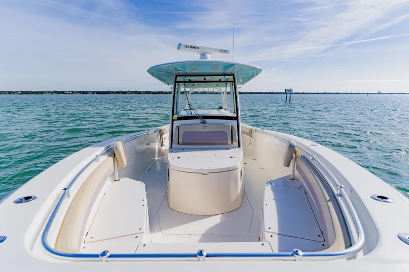  Yacht Photos Pics 2017 Cobia 344 Center Console boat on open water, clear sky.
