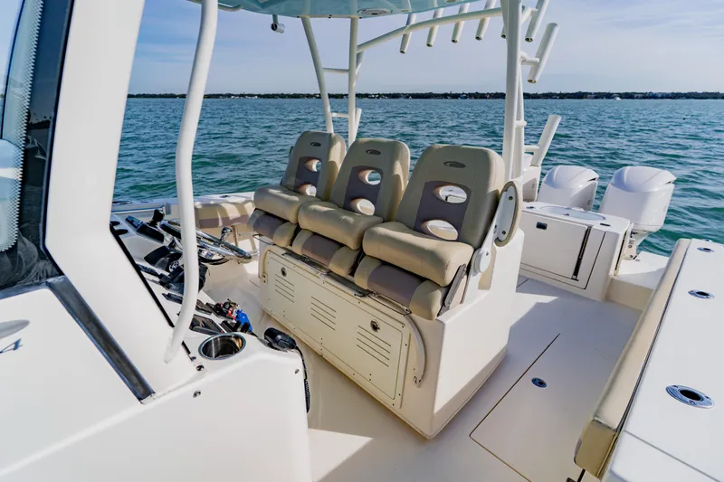  Yacht Photos Pics 2017 Cobia 344 Center Console boat interior with seating and ocean view.