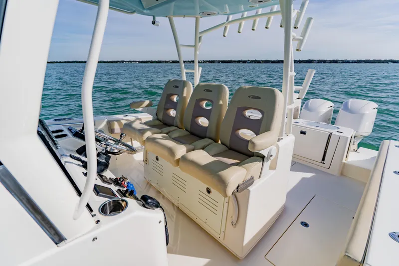  Yacht Photos Pics 2017 Cobia 344 Center Console boat interior with seating and ocean view.