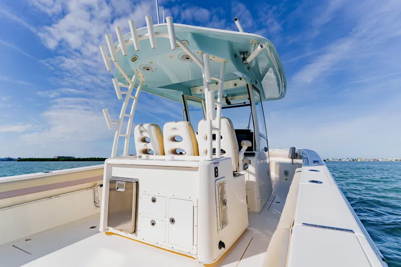  Yacht Photos Pics 2017 Cobia 344 Center Console boat on open water under blue sky.