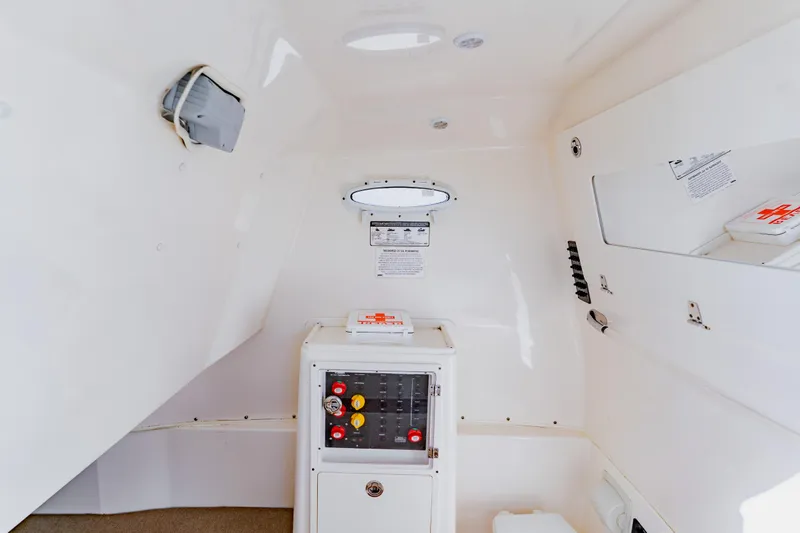  Yacht Photos Pics 2017 Cobia 344 Center Console interior with control panel and storage compartments.
