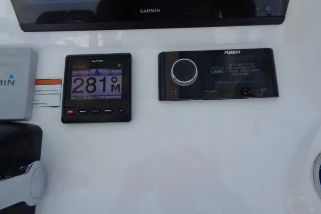  Yacht Photos Pics Control panel of a 2020 Intrepid 345 Nomad FE with Garmin and Fusion displays.