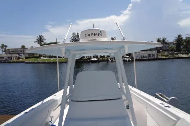  Yacht Photos Pics 2020 Intrepid 345 Nomad FE boat with Garmin equipment on a sunny waterfront.