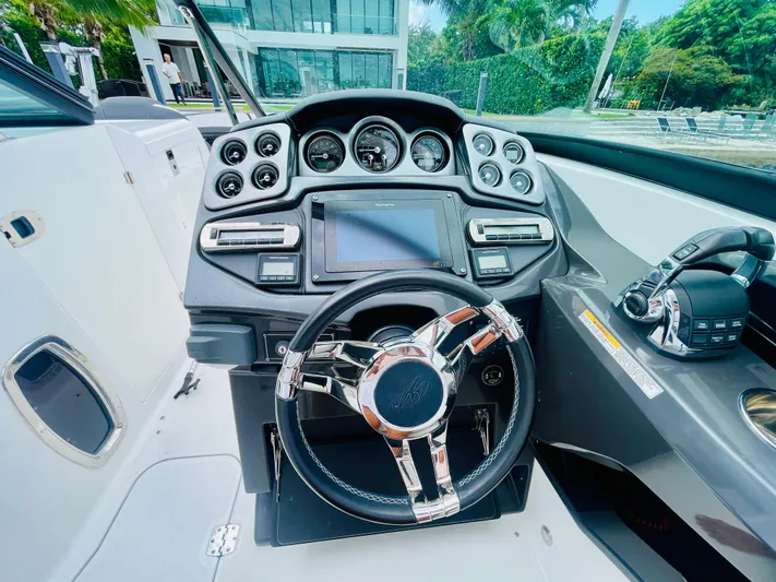  Yacht Photos Pics 2020 Monterey 328 SS boat dashboard with modern controls and steering wheel.