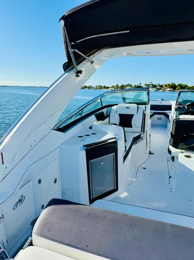  Yacht Photos Pics 2020 Monterey 328 SS boat interior with sleek seating and open water view.