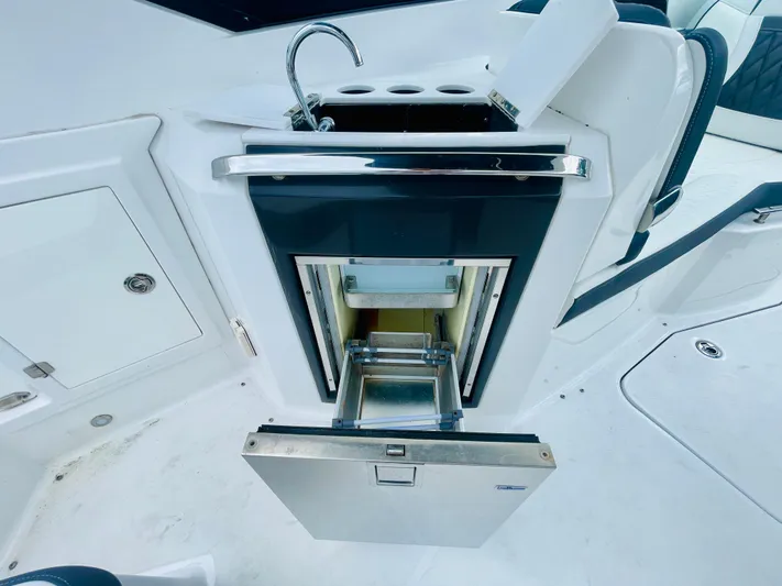  Yacht Photos Pics 2020 Monterey 328SS Super Sport boat interior with open drawer and sink.
