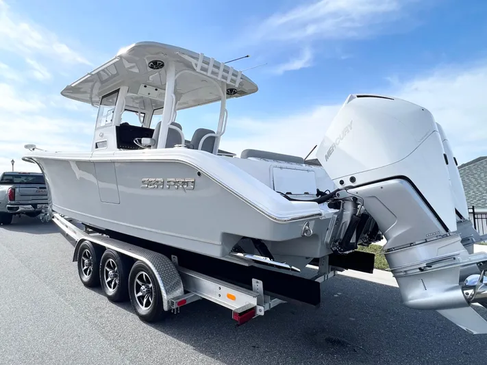  Yacht Photos Pics 2022 Sea Pro 320 DLX Offshore boat on trailer, featuring dual Mercury outboard engines.