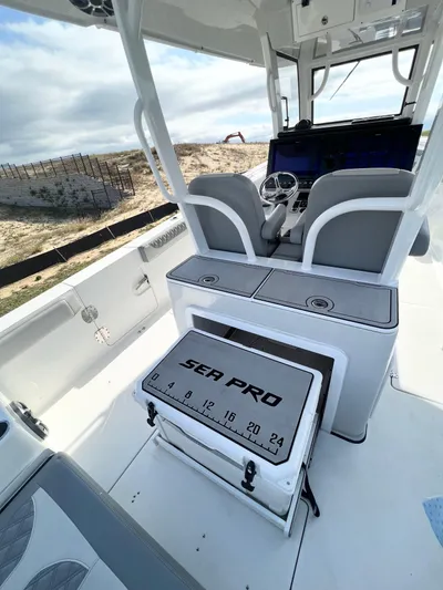  Yacht Photos Pics 2022 Sea Pro 320 DLX Offshore boat interior with helm and seating.